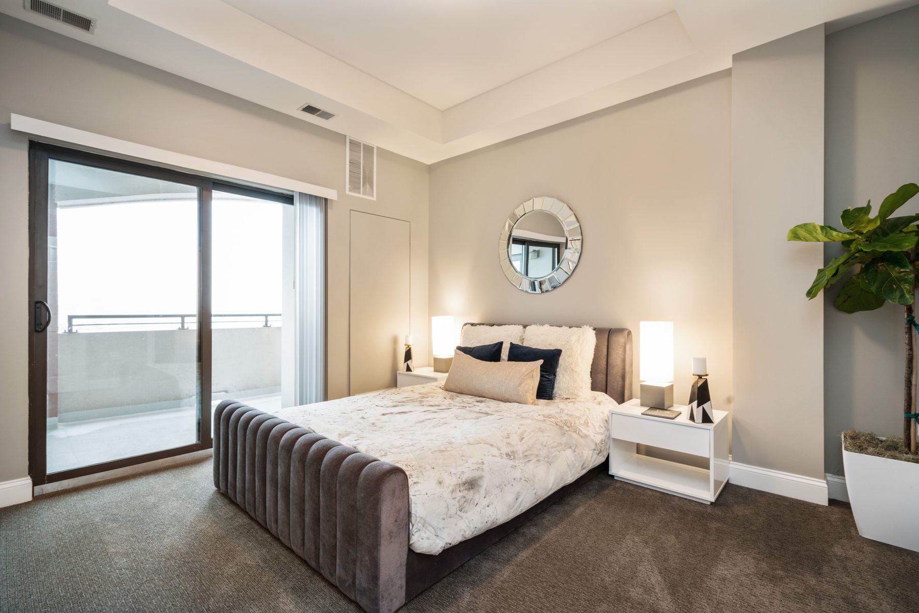 Sunset Balcony Suite bedroom opening onto a balcony