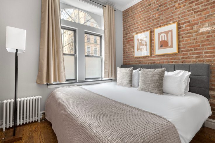 Bed with hotel linens