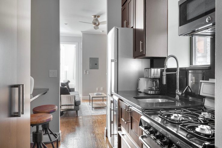 Galley kitchen with brick