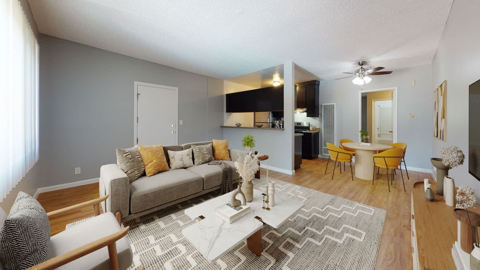 Bright living room with sectional sofa and dining nook